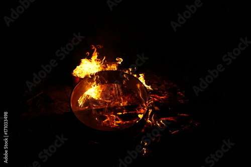 Wooden rings burning on a campfire