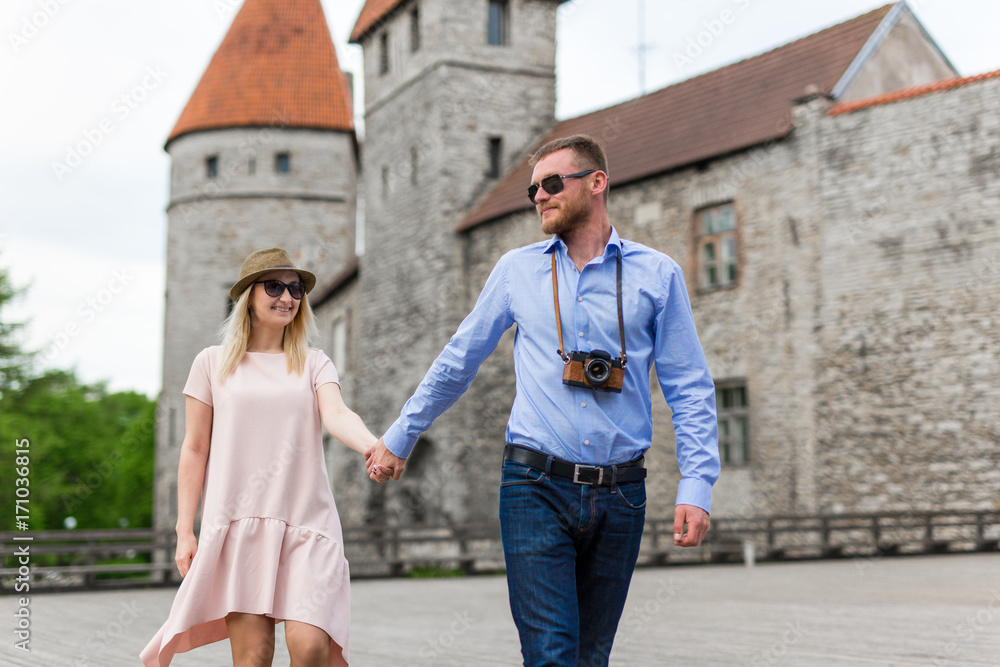 Fototapeta premium travel concept - two tourists in love walking in old town
