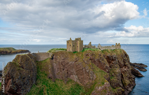 A view of Dunnottar Castle from west side in cloudy spring weather, Scotland