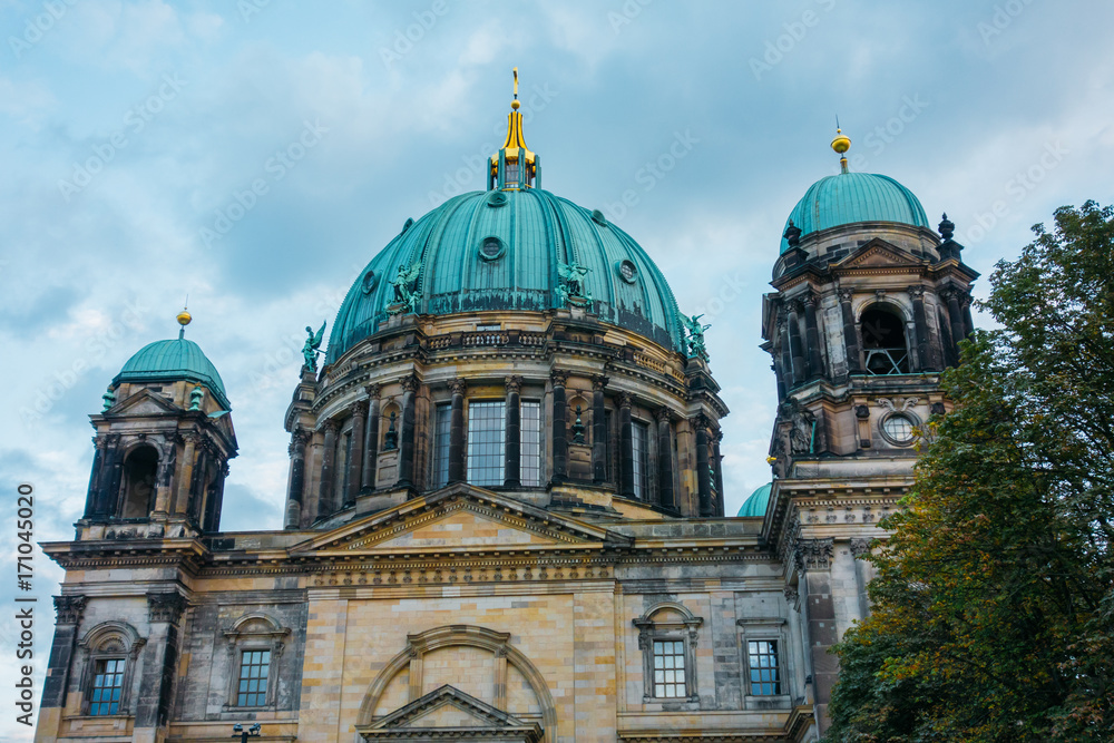 berlin cathedral with green tree