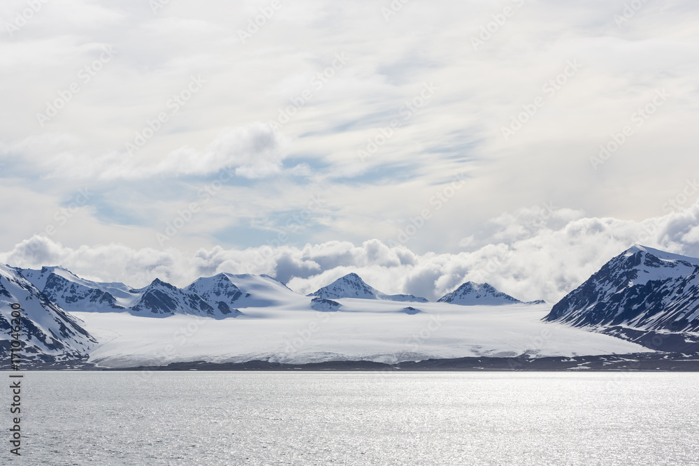 Sea bay with mountains and glacier in Svalbard, Spitsbergen, Norway