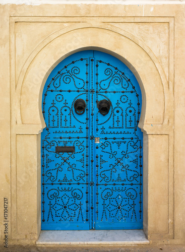 Blue aged door with ornament from Sidi Bou Said photo