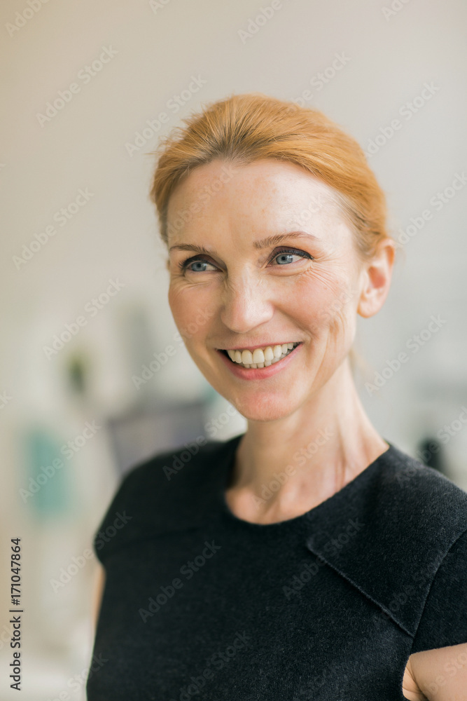 Healthy woman with toothy smile wearing elegant black dress Healthy woman with toothy smile wearing elegant black dress