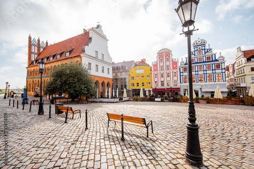 View on the Market square with beautiful colorful buildings during the morning light in Szczecin city, Poland