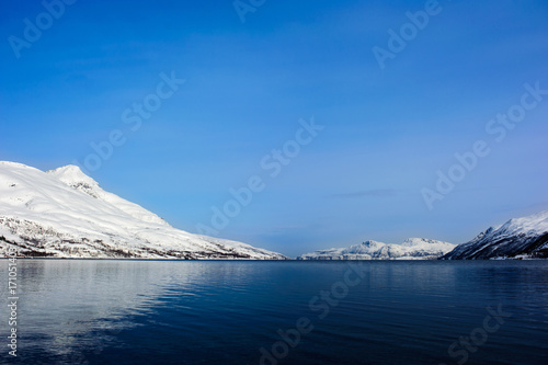 Mountain reflected in the ocean in Tromsø
