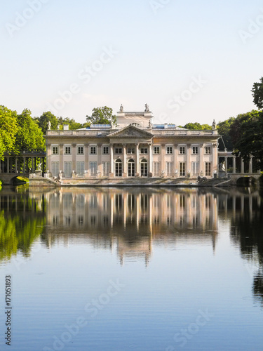 Palac lazienkowski (Lazienski Palace) reflected on water in Warsaw, Poland