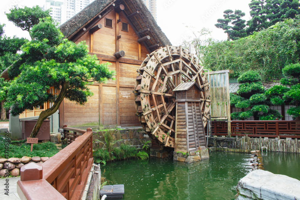 Wood water turbine antique in public park Wood water turbine antique in public park