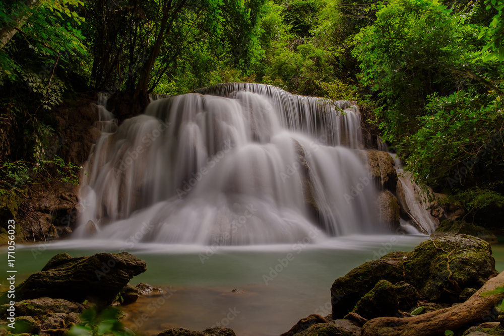 Photography of waterfall with long exposure. The beautiful waterfall in the national park in Kanchanaburi province, Thailand.