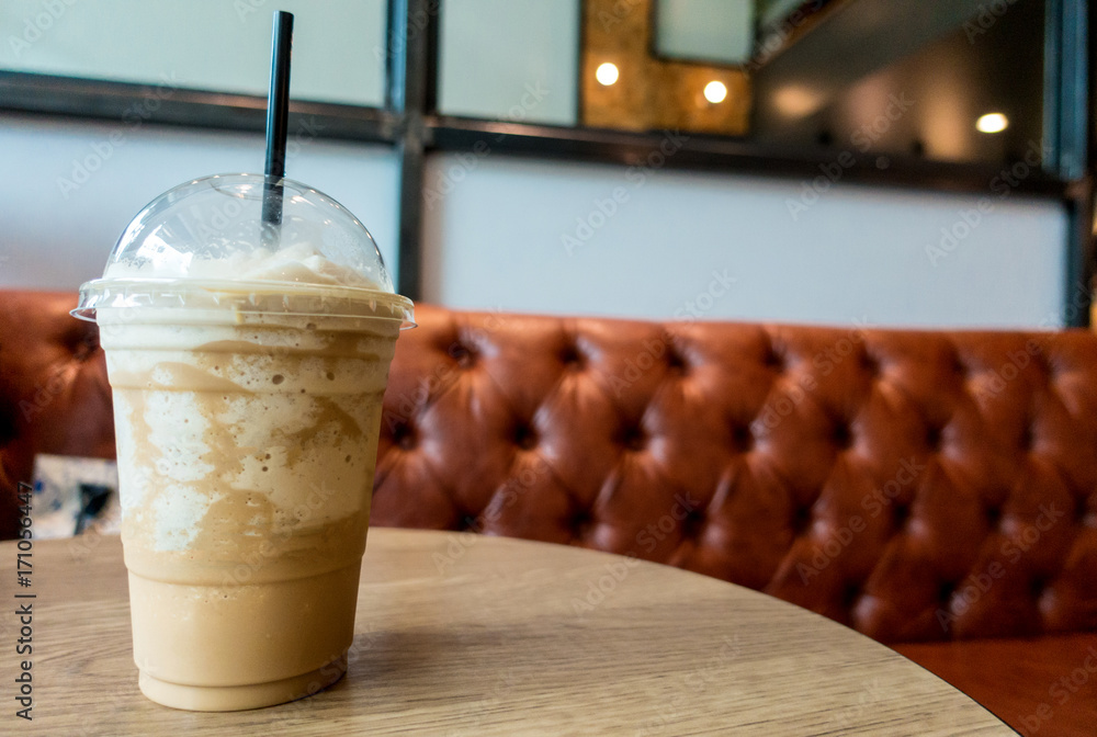 Frappe coffee on wood table in retro coffee shop Frappe coffee on wood table in retro coffee shop