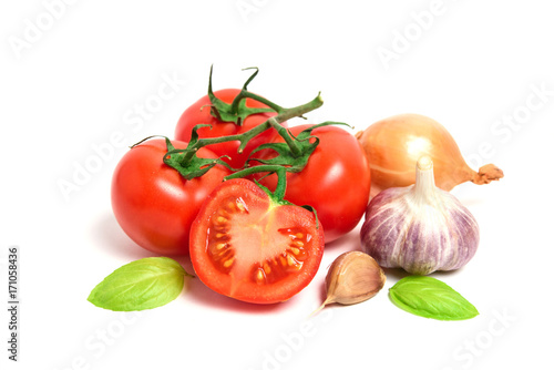 Fresh tomatoes, garlic and onion isolated on white background