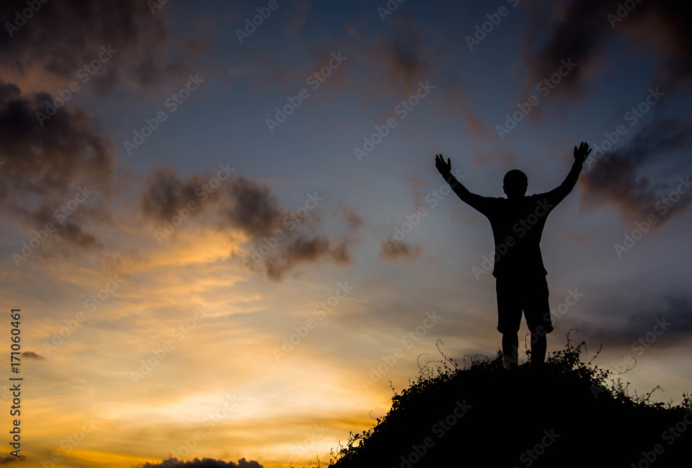 silhouette man on hill with sky for background