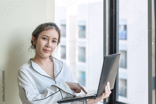 asian freelance work concept : smile women use laptop modern business technology