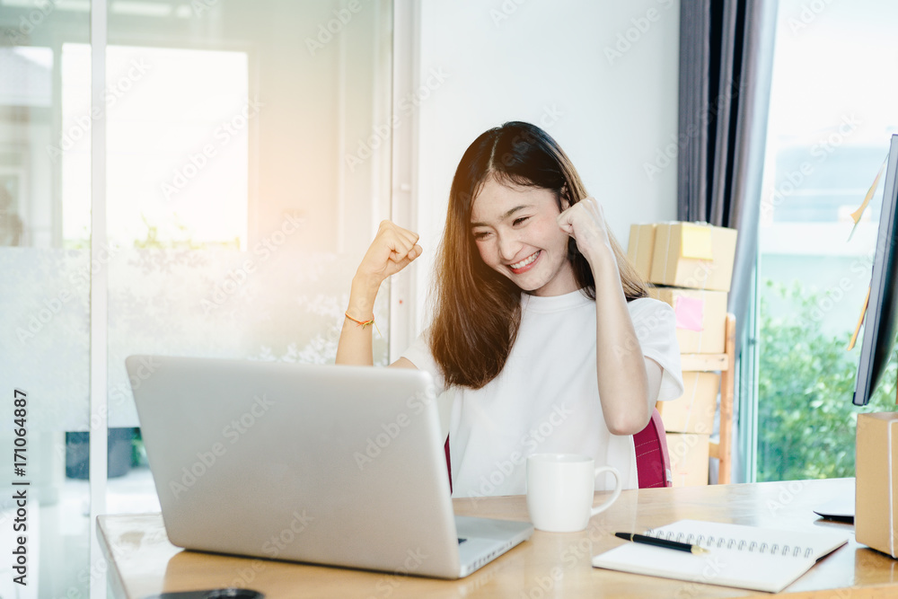 Young asian girl is freelancer with her private business at home office, working with laptop, coffee, online marketing, Customer order and packaging or packing. Young asian girl is freelancer with her private business at home office, working with laptop, coffee, online marketing, Customer order and packaging or packing.