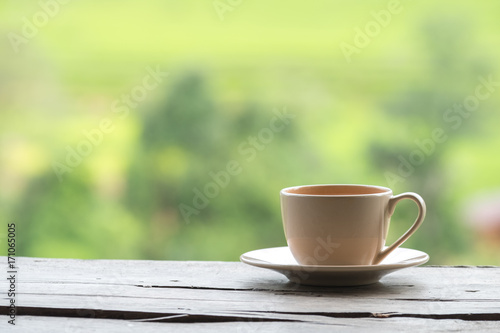 Hot coffee cup with nature background
