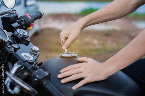 Hand the key open tank cap motorcycle fuel tank.