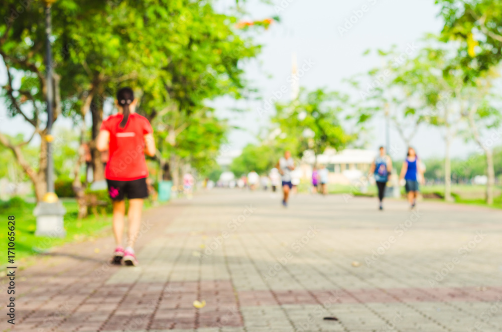blur red runner exercise with running or jogging on the morning in the park for healthy. blur red runner exercise with running or jogging on the morning in the park for healthy.