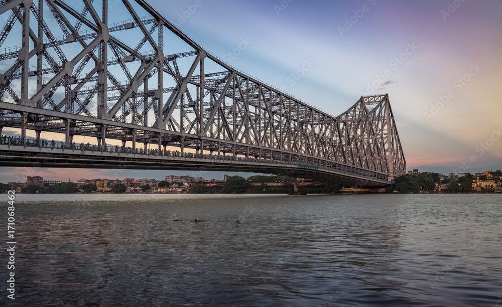 Howrah bridge - the cantilever bridge on river Hooghly at sunrise Howrah bridge - the cantilever bridge on river Hooghly at sunrise