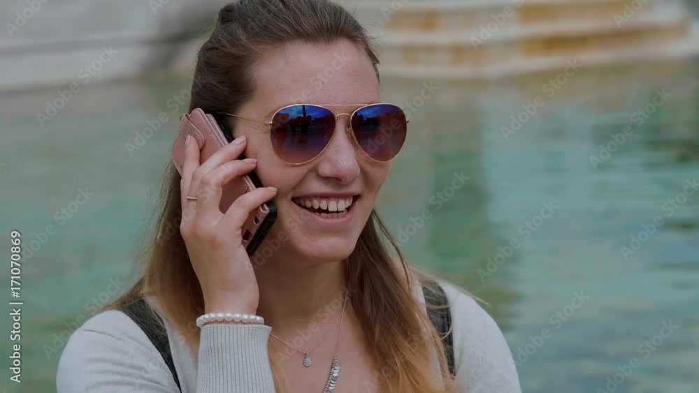 Young girl is taking a phone call Young girl is taking a phone call