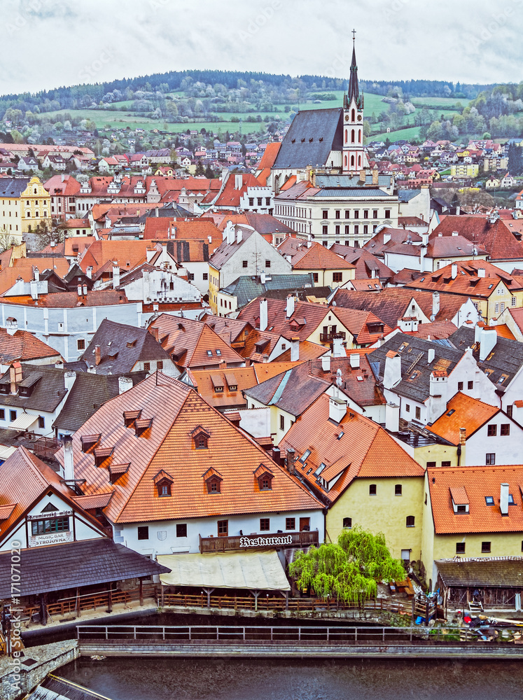 CZECH KRUMLOV, CZECH REPUBLIC - APRIL 17, 2017: View of the city in the spring. It's raining. The historical center of the city in 1992 is listed as a UNESCO World Heritage Site.