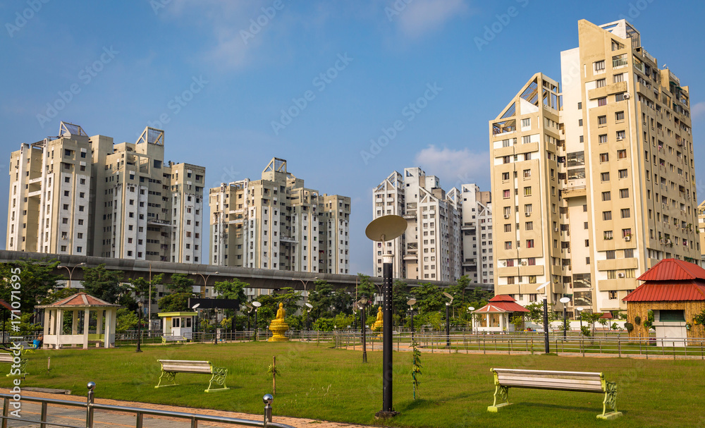 View of planned city with modern residential buildings with park and over bridge at Kolkata India