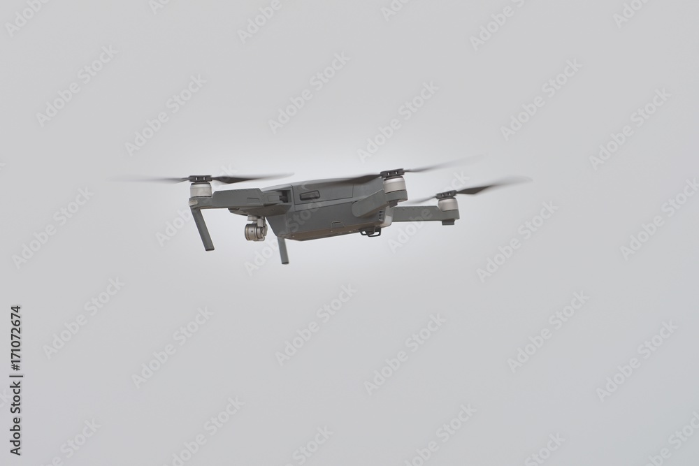 gray drone in flight gray drone in flight