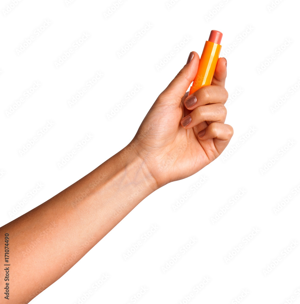 Woman holding pink lipstick in her hand. Woman holding pink lipstick in her hand.