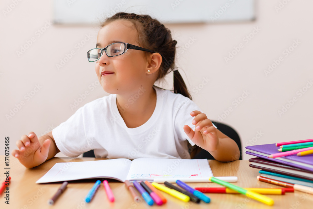 Little girl doing school work at home Little girl doing school work at home