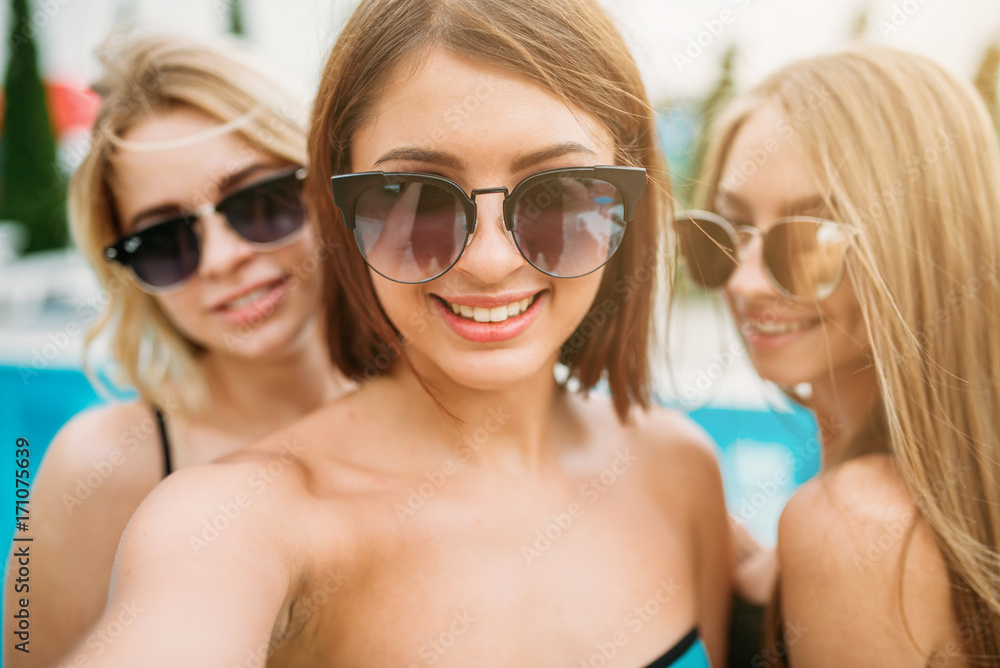 Selfie shot, three happy girls in sunglasses Selfie shot, three happy girls in sunglasses