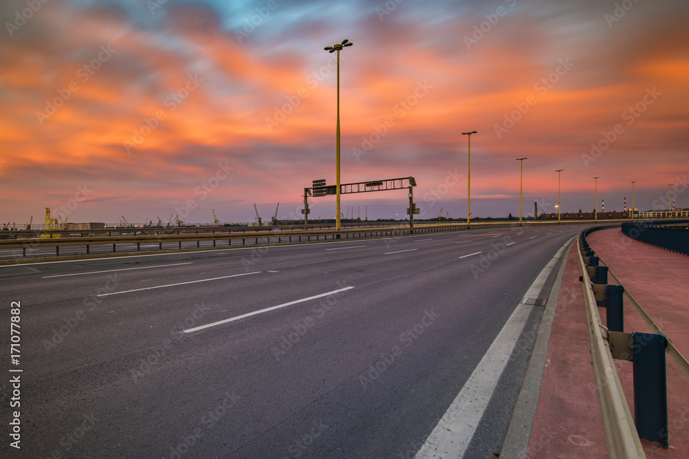 Fototapeta premium The road leading to Szczecin after sunset, traces of lights of cars
