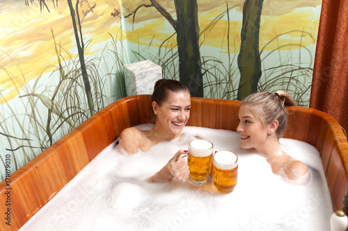 Beautiful women in a beer spa.