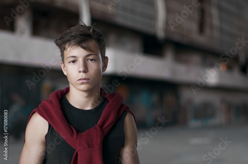 Serious young man in an old stadium, portrait