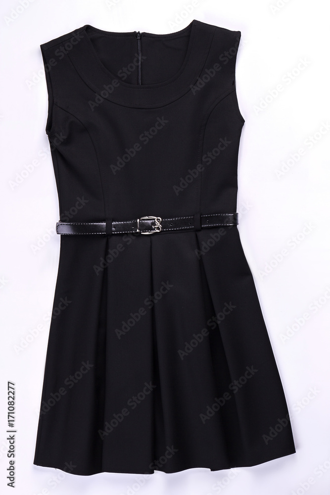 Beautiful black belted pleated dress. Classic pleated black dress isolated on white. Black dress with pleats on sale. Beautiful black belted pleated dress. Classic pleated black dress isolated on white. Black dress with pleats on sale.