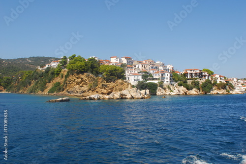 Fototapeta Naklejka Na Ścianę i Meble -  Skiathos town on Skiathos Island, Greece. Beautiful view of the old town with boats in the harbor.