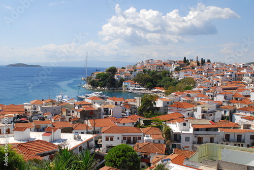 Skiathos town on Skiathos Island  Greece. Beautiful view of the old town with boats in the harbor.