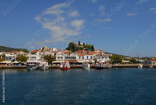Skiathos town on Skiathos Island, Greece. Beautiful view of the old town with boats in the harbor.