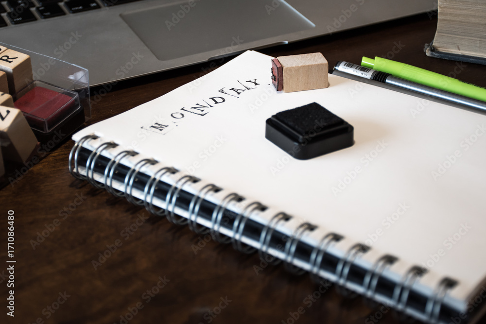 Notebook with a stamp and text Monday. Notebook with a stamp and text Monday.