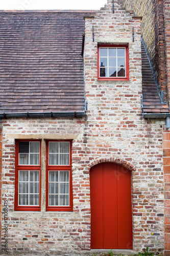 Red door on old European stone house