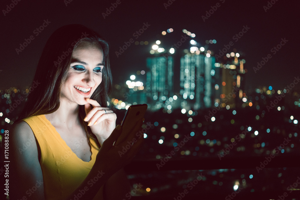 Woman using dating app on social media phone having fun Woman using dating app on social media phone having fun