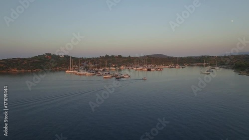 Aerial view of yacht port/ Drone flying over the marina on sunrise