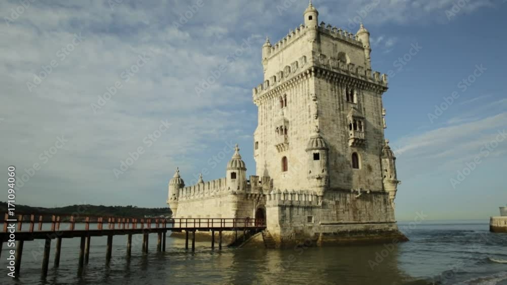 Belem Tower in low tide in the morning. Torre de Belem is Unesco Heritage and symbol of Lisbon, in Belem District on Tagus River. Belem Tower is the most visited tourist attraction in Lisbon, Portugal Belem Tower in low tide in the morning. Torre de Belem is Unesco Heritage and symbol of Lisbon, in Belem District on Tagus River. Belem Tower is the most visited tourist attraction in Lisbon, Portugal