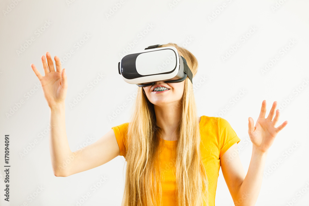 Girl wearing virtual reality goggles. Girl wearing virtual reality goggles.