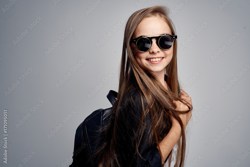 little girl in sunglasses with a backpack, portrait little girl in sunglasses with a backpack, portrait