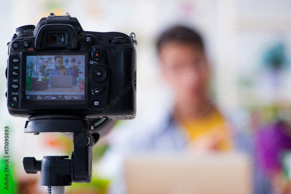 Man florist gardener vlogger blogger shooting video on camera Man florist gardener vlogger blogger shooting video on camera