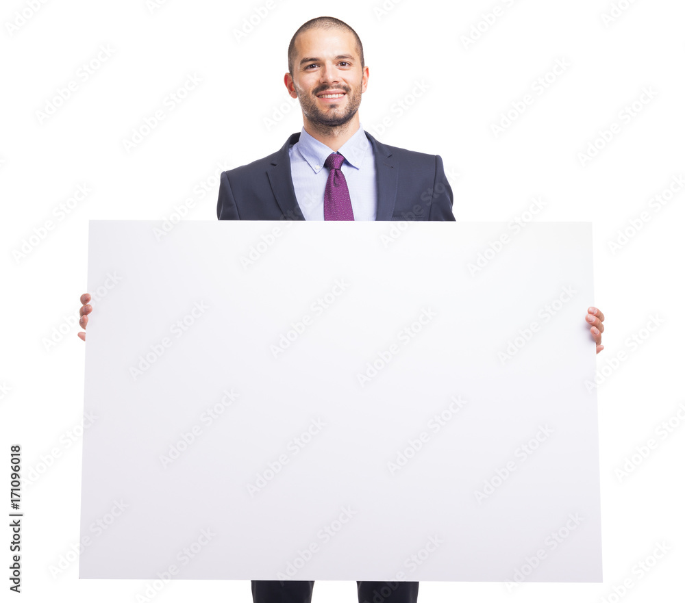 Handsome business man holding a white banner on white background Handsome business man holding a white banner on white background