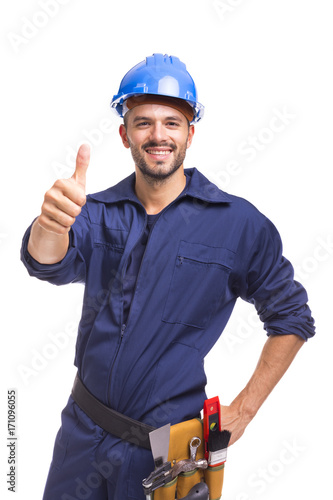 Smiling worker thumbs up on white background