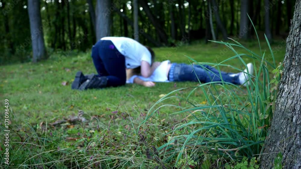Zombie woman eating dead man in the woods Zombie woman eating dead man in the woods