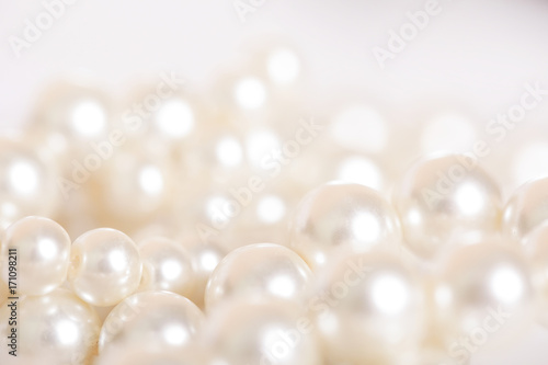 Fototapeta Pile of pearls on the white background