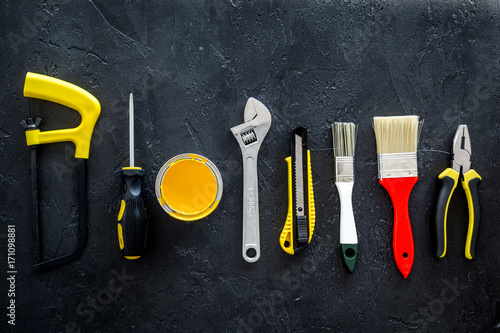 set of tools for build, paint and repair house on dark background top view