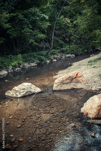 small mountain river with lot of stones and rocks
