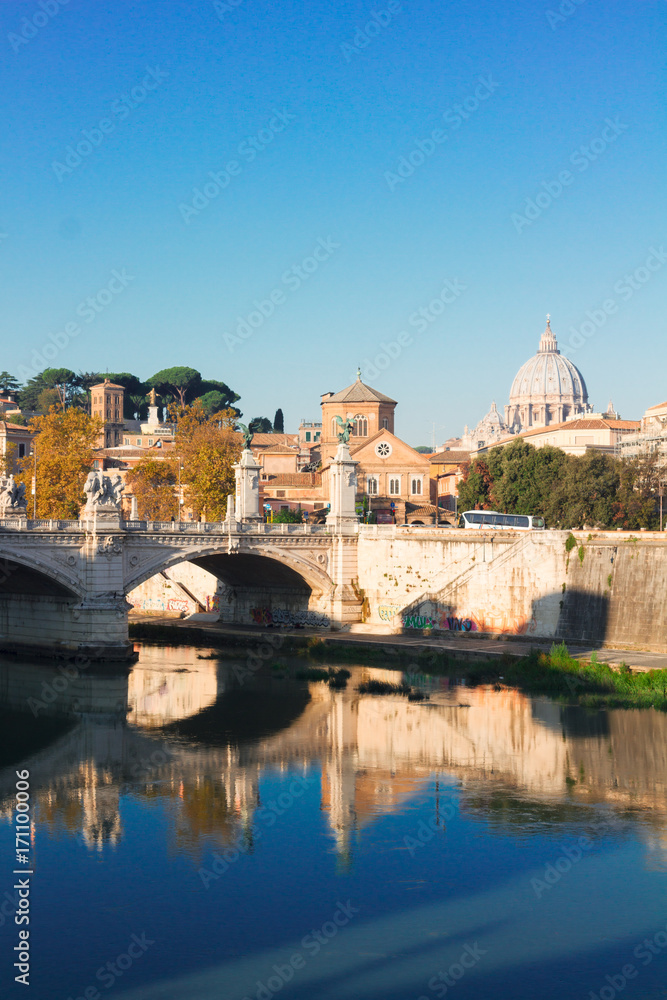 St. Peter's cathedral dome over bridge at fall in Rome, Italy